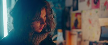 Movie still from “A Taste of Hunger” (2021), directed by Christoffer Boe – A person with long hair; Close Up shot, Over the shoulder angle