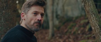 Movie still from “A Taste of Hunger” (2021), directed by Christoffer Boe – A person with a beard; Close Up shot, Low angle