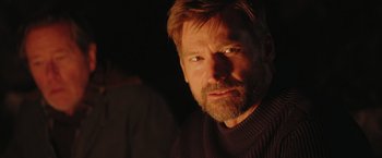 Movie still from “A Taste of Hunger” (2021), directed by Christoffer Boe – A person with a beard; Close Up shot, Over the shoulder angle