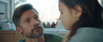 Movie still from “A Taste of Hunger” (2021), directed by Christoffer Boe – A man and a girl looking at one another; Close Up shot, Over the shoulder angle