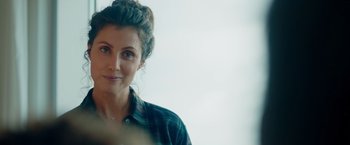 Movie still from “A Taste of Hunger” (2021), directed by Christoffer Boe – A person wearing a plaid shirt; Close Up shot, Over the shoulder angle