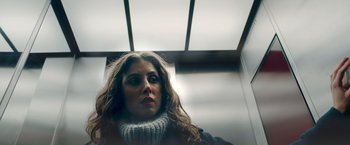 Movie still from “A Taste of Hunger” (2021), directed by Christoffer Boe – A person wearing a sweater; Close Up shot, Low angle