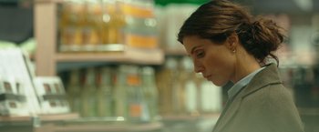 Movie still from “A Taste of Hunger” (2021), directed by Christoffer Boe – A person looking down at something; Close Up shot, Over the shoulder angle