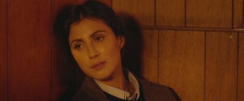 Movie still from “A Taste of Hunger” (2021), directed by Christoffer Boe – A person wearing a jacket; Close Up shot, Over the shoulder angle