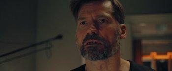 Movie still from “A Taste of Hunger” (2021), directed by Christoffer Boe – A person with a beard; Close Up shot, Over the shoulder angle