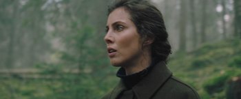 Movie still from “A Taste of Hunger” (2021), directed by Christoffer Boe – A person wearing a coat; Close Up shot, Over the shoulder angle