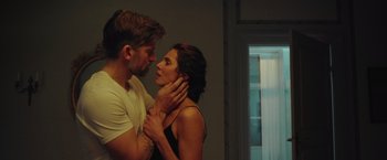 Movie still from “A Taste of Hunger” (2021), directed by Christoffer Boe – A man and a woman standing next to each other; Close Up shot, Over the shoulder angle