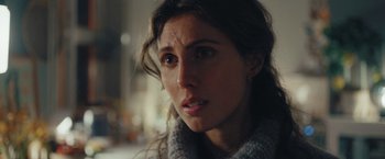 Movie still from “A Taste of Hunger” (2021), directed by Christoffer Boe – A person wearing a sweater; Close Up shot, Over the shoulder angle