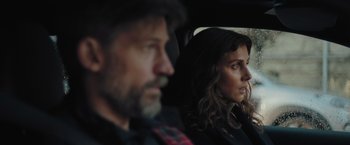 Movie still from “A Taste of Hunger” (2021), directed by Christoffer Boe – A man and a woman sitting in the back of a car; Close Up shot, Over the shoulder angle