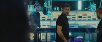 Movie still from “A Taste of Hunger” (2021), directed by Christoffer Boe – A man standing next to another man in a kitchen; Medium shot, Low angle