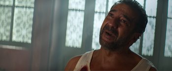 Movie still from “Expend4bles” (2023), directed by Scott Waugh – A person with a bandage on his arm; Close Up shot, Low angle