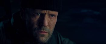 Movie still from “Expend4bles” (2023), directed by Scott Waugh – A person wearing a hat; Close Up shot, Low angle