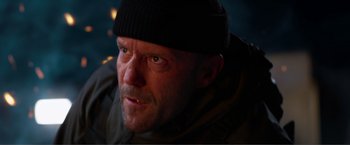 Movie still from “Expend4bles” (2023), directed by Scott Waugh – A person wearing a hat; Close Up shot, Low angle