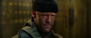 Movie still from “Expend4bles” (2023), directed by Scott Waugh – A person wearing a hat; Close Up shot, Low angle