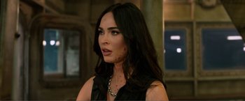 Movie still from “Expend4bles” (2023), directed by Scott Waugh – A person wearing a black shirt; Close Up shot, Over the shoulder angle