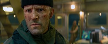 Movie still from “Expend4bles” (2023), directed by Scott Waugh – A person wearing a hat; Close Up shot, Low angle