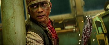 Movie still from “Expend4bles” (2023), directed by Scott Waugh – A person wearing a cowboy hat; Close Up shot, Low angle