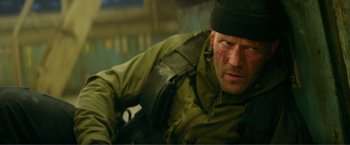 Movie still from “Expend4bles” (2023), directed by Scott Waugh – A person wearing a hat; Close Up shot, Low angle