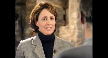 Movie still from “Explorer” (2022), directed by Matthew Dyas – A person wearing a jacket; Close Up shot, Over the shoulder angle