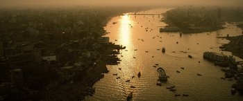 Movie still from “Extraction II” (2023), directed by Sam Hargrave – A large body of water filled with lots of boats on top of it; Extreme Wide shot, High angle