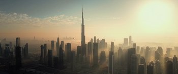 Movie still from “Extraction II” (2023), directed by Sam Hargrave – A view of a city skyline at sunset; Extreme Wide shot, Low angle