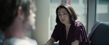 Movie still from “Extraction II” (2023), directed by Sam Hargrave – A person sitting on a chair; Close Up shot, Over the shoulder angle