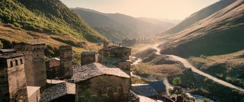 Movie still from “Extraction II” (2023), directed by Sam Hargrave – A view of a valley with a river running through it; Extreme Wide shot, Low angle