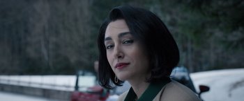 Movie still from “Extraction II” (2023), directed by Sam Hargrave – A person with short black hair; Close Up shot, Over the shoulder angle