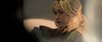 Movie still from “Extraction II” (2023), directed by Sam Hargrave – A person wearing a sweater; Close Up shot, Over the shoulder angle