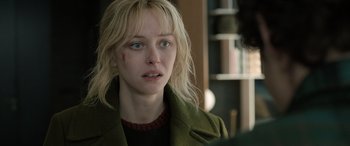 Movie still from “Extraction II” (2023), directed by Sam Hargrave – A person wearing a green jacket; Close Up shot, Over the shoulder angle