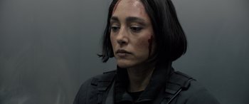 Movie still from “Extraction II” (2023), directed by Sam Hargrave – A woman with blood all over her face and shoulder; Close Up shot, Low angle