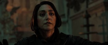 Movie still from “Extraction II” (2023), directed by Sam Hargrave – A person wearing a black jacket; Close Up shot, Over the shoulder angle