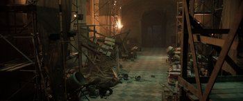 Movie still from “Extraction II” (2023), directed by Sam Hargrave – A room that has a lot of debris on the floor; Extreme Wide shot, High angle