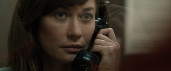 Movie still from “Extraction II” (2023), directed by Sam Hargrave – A person talking on a phone; Close Up shot, Over the shoulder angle