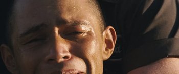 Movie still from “F9: The Fast Saga” (2021), directed by Justin Lin – A man's face with water droplets on his face; Extreme Close Up shot, High angle