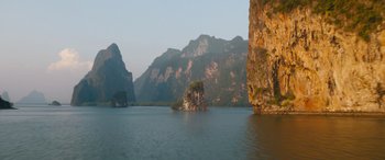 Movie still from “F9: The Fast Saga” (2021), directed by Justin Lin – A large body of water surrounded by mountains; Extreme Wide shot, High angle