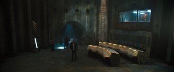 Movie still from “F9: The Fast Saga” (2021), directed by Justin Lin – A group of people standing in a room with a bunch of tables; Extreme Wide shot, High angle