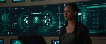 Movie still from “F9: The Fast Saga” (2021), directed by Justin Lin – A woman standing in front of a computer screen; Close Up shot, Over the shoulder angle