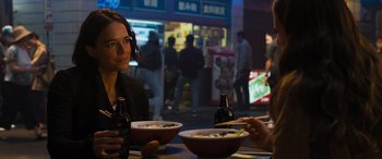 Movie still from “F9: The Fast Saga” (2021), directed by Justin Lin – Two people sitting at a table with bowls of food on it; Close Up shot, Over the shoulder angle