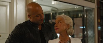 Movie still from “F9: The Fast Saga” (2021), directed by Justin Lin – A man and a woman standing next to each other; Close Up shot, Over the shoulder angle