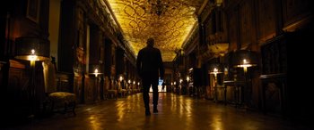 Movie still from “F9: The Fast Saga” (2021), directed by Justin Lin – A man walking down a hall way in a building; Extreme Wide shot, Low angle