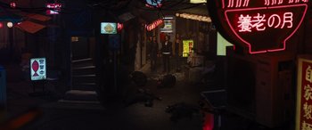 Movie still from “F9: The Fast Saga” (2021), directed by Justin Lin – A group of people standing in a dark alley; Extreme Wide shot, High angle