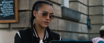 Movie still from “F9: The Fast Saga” (2021), directed by Justin Lin – A young woman wearing sunglasses looking at a tablet; Close Up shot, Over the shoulder angle
