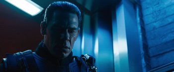 Movie still from “F9: The Fast Saga” (2021), directed by Justin Lin – A person wearing a suit and tie; Close Up shot, Low angle