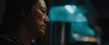 Movie still from “F9: The Fast Saga” (2021), directed by Justin Lin – A person's face in a dark room; Close Up shot, Low angle