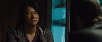 Movie still from “F9: The Fast Saga” (2021), directed by Justin Lin – A woman sitting in front of an open refrigerator; Close Up shot, Over the shoulder angle