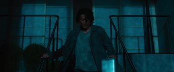 Movie still from “F9: The Fast Saga” (2021), directed by Justin Lin – A man walking down a flight of stairs at night; Medium shot, Low angle