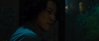 Movie still from “F9: The Fast Saga” (2021), directed by Justin Lin – A person with long black hair; Close Up shot, Over the shoulder angle