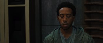 Movie still from “F9: The Fast Saga” (2021), directed by Justin Lin – A man with his eyes closed with his eyes closed; Close Up shot, Low angle