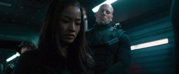 Movie still from “F9: The Fast Saga” (2021), directed by Justin Lin – A man and a woman in a dark room; Close Up shot, Low angle